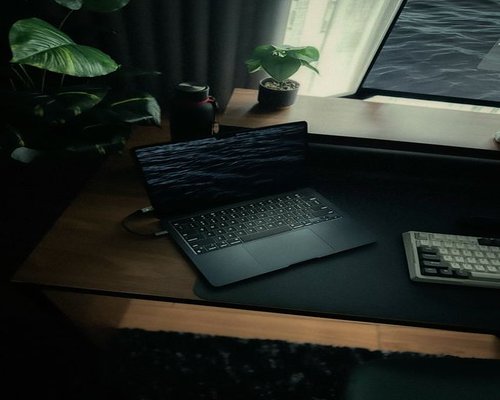 comfortable workspace with water on the desk