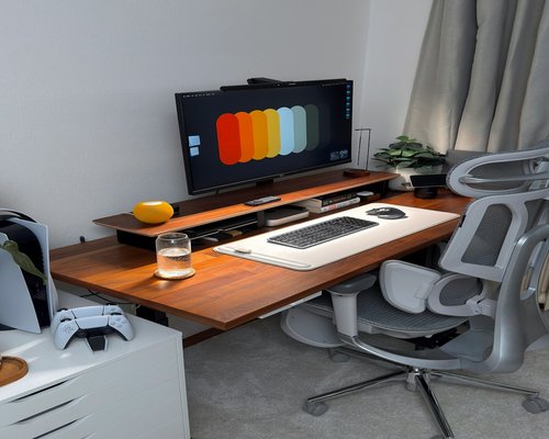 comfortable workspace with water on the desk